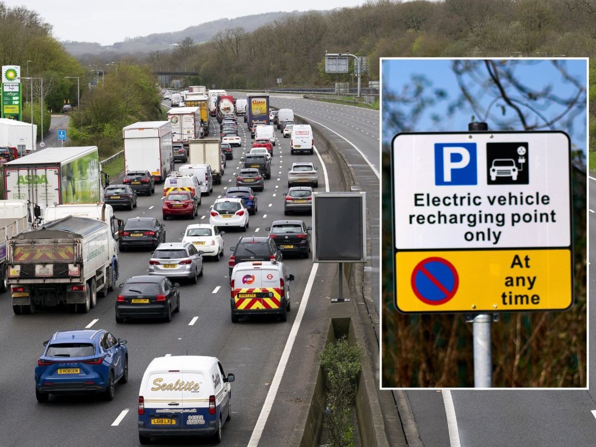 Busy motorway and an EV charging sign