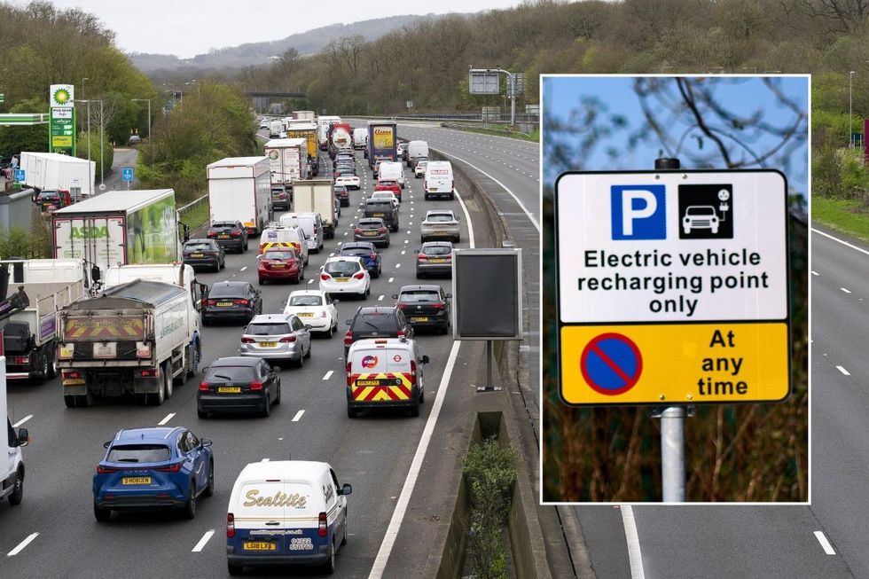 Busy motorway and an EV charging sign