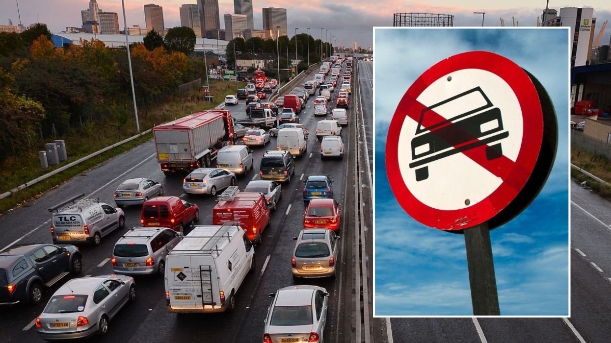 Busy road and a car ban sign