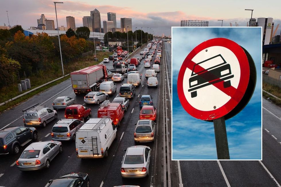 Busy road and a car ban sign