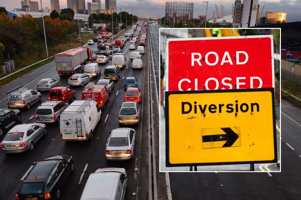 Busy traffic and a diversion road closed sign