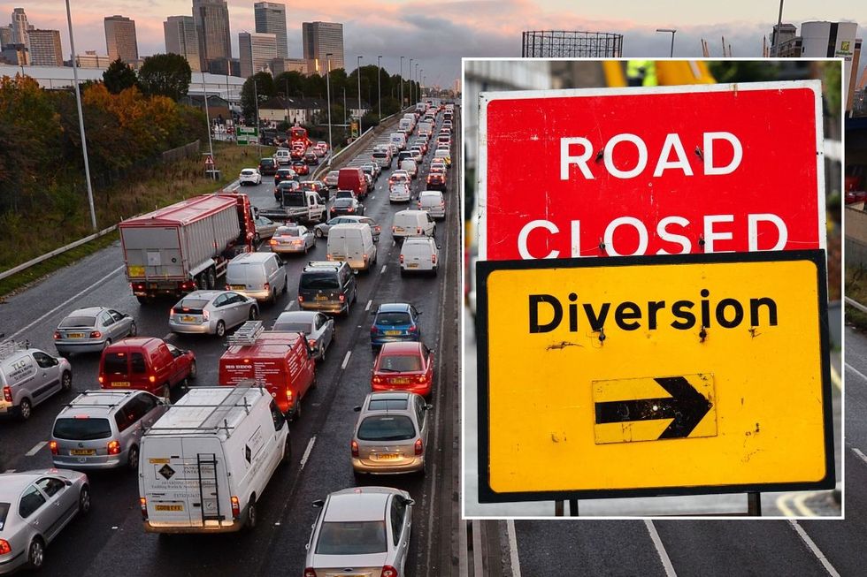 Busy traffic and a road closed sign
