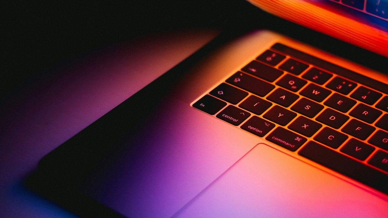 butterfly keyboard pictured on previous macbook air laptop design with colourful light from the screen