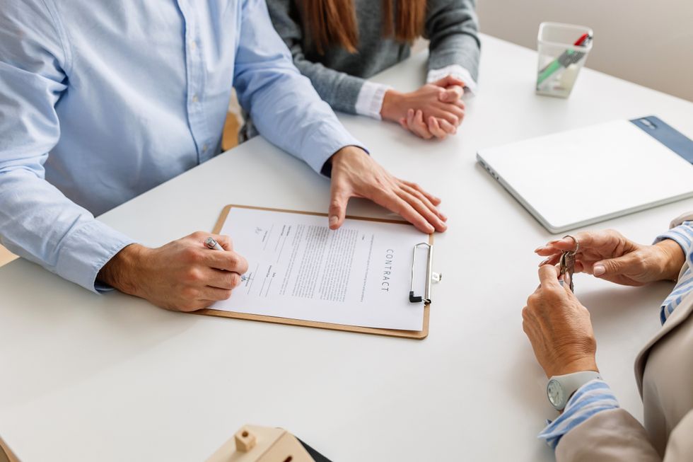 Buyers signing a contract