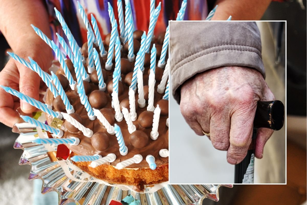 CAKE WITH CANDLES AND HAND ON WALKING STICK