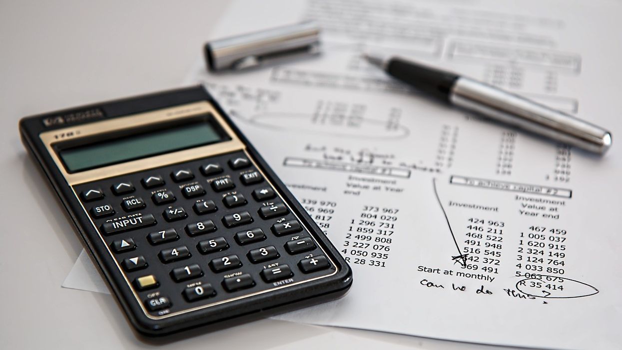 Calculator and paper with numbers