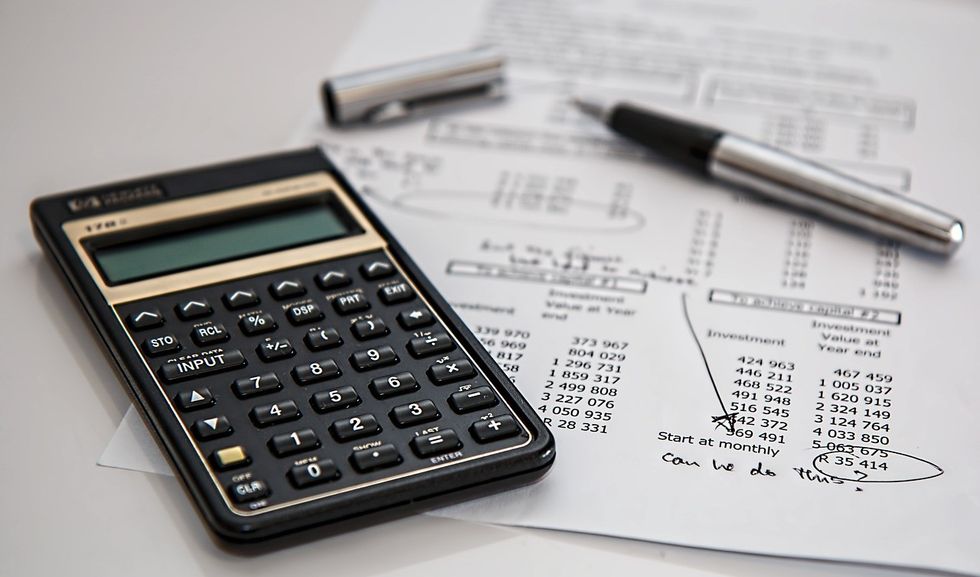 Calculator and paper with numbers