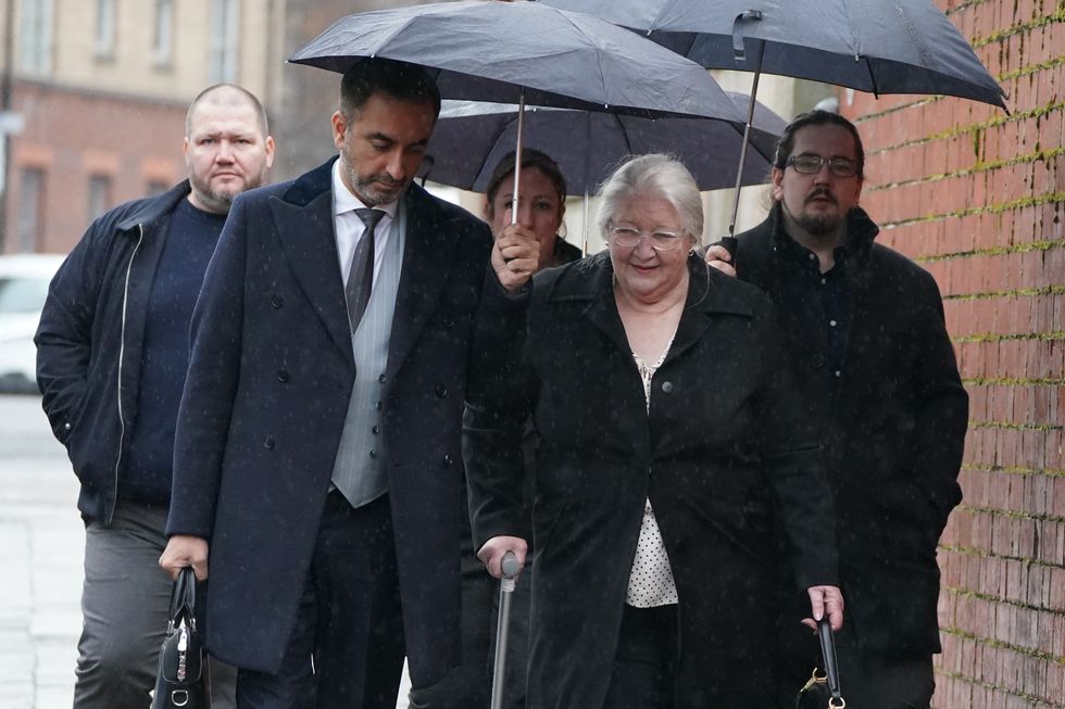 Caldwell's mother with family and lawyers