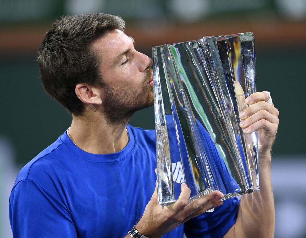 Cameron Norrie (GBR) holds the championship trophy after defeating Nikoloz Basilashvili (GEO) in the men’s final in the BNP Paribas Open at the Indian Wells Tennis Garden. Mandatory Credit: Jayne Kamin-Oncea-USA TODAY Sports TPX IMAGES OF THE DAY