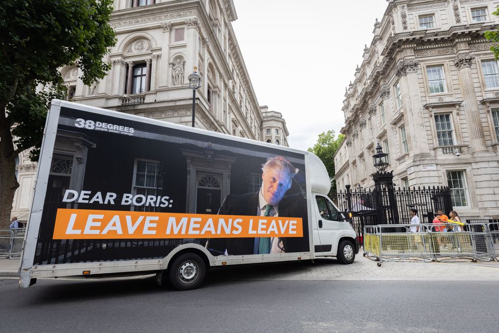 Campaign organisation 38 Degrees park a removal van outside Downing Street, London as they arrive with a petition demanding Prime Minister Boris Johnson stands down now. Picture date: Tuesday July 12, 2022.