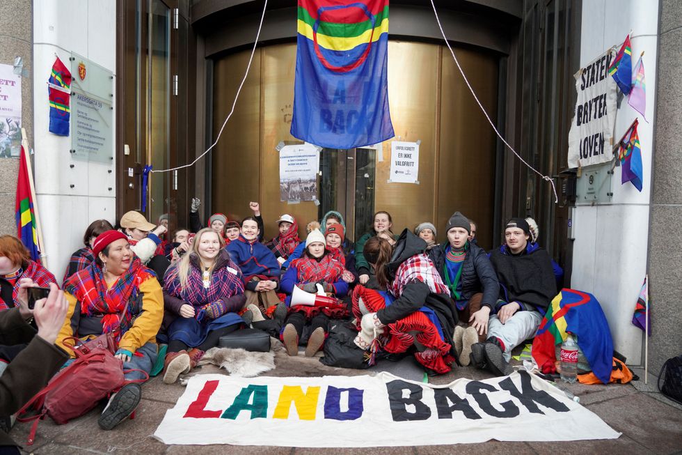 Campaigners from Nature and Youth and the Norwegian Samirs Riksforbund Nuorat block the entrances to the Ministry of Oil and Energy with Greta Thunberg in Oslo, Norway, February 27, 2023. The reason for the action is that the wind turbines at Fosen, which the Supreme Court has said are illegal, have not been demolished. NTB/Ole Berg-Rusten via REUTERS   ATTENTION EDITORS - THIS IMAGE WAS PROVIDED BY A THIRD PARTY. NORWAY OUT. NO COMMERCIAL OR EDITORIAL SALES IN NORWAY.