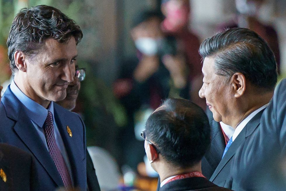 Canada's Prime Minister Justin Trudeau speaks with China's President Xi Jinping at the G20 Leaders' Summit in Bali, Indonesia, November 15, 2022.  Adam Scotti/Prime Minister's Office/Handout via REUTERS. THIS IMAGE HAS BEEN SUPPLIED BY A THIRD PARTY. THIS IMAGE WAS PROCESSED BY REUTERS TO ENHANCE QUALITY. AN UNPROCESSED VERSION HAS BEEN PROVIDED SEPARATELY.