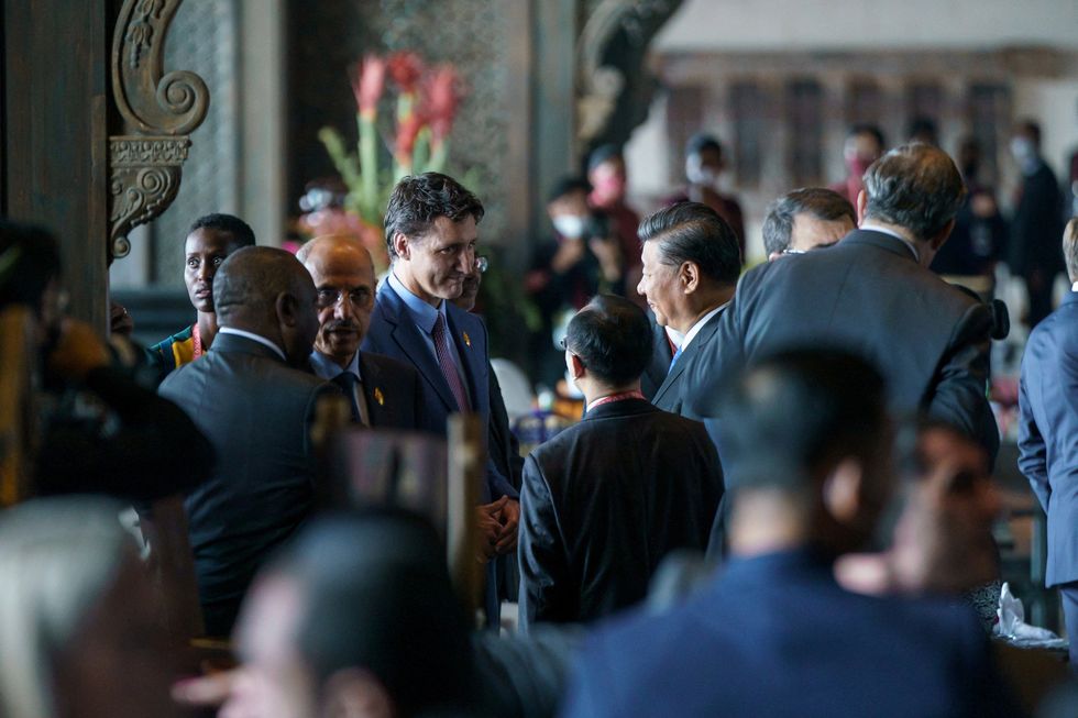 Canada's Prime Minister Justin Trudeau speaks with China's President Xi Jinping at the G20 Leaders' Summit in Bali, Indonesia, November 15, 2022.  Adam Scotti/Prime Minister's Office/Handout via REUTERS. THIS IMAGE HAS BEEN SUPPLIED BY A THIRD PARTY.