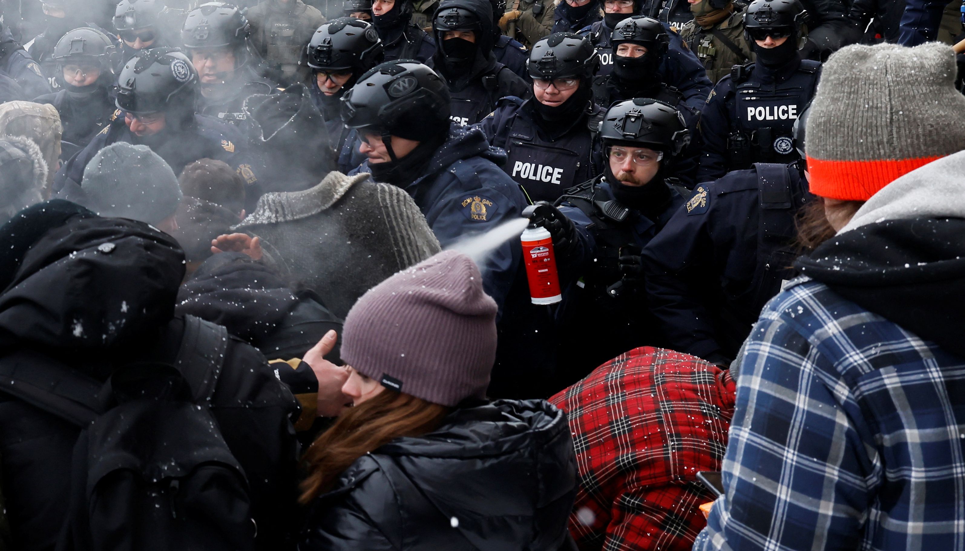 Canadian police officers faced off with protesters in Ottawa, Canada, on Saturday