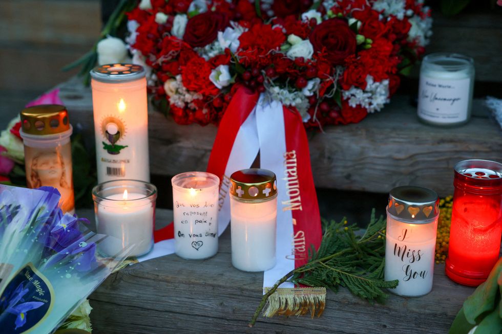Candles lit in tribute to the Switzerland bar fire victims