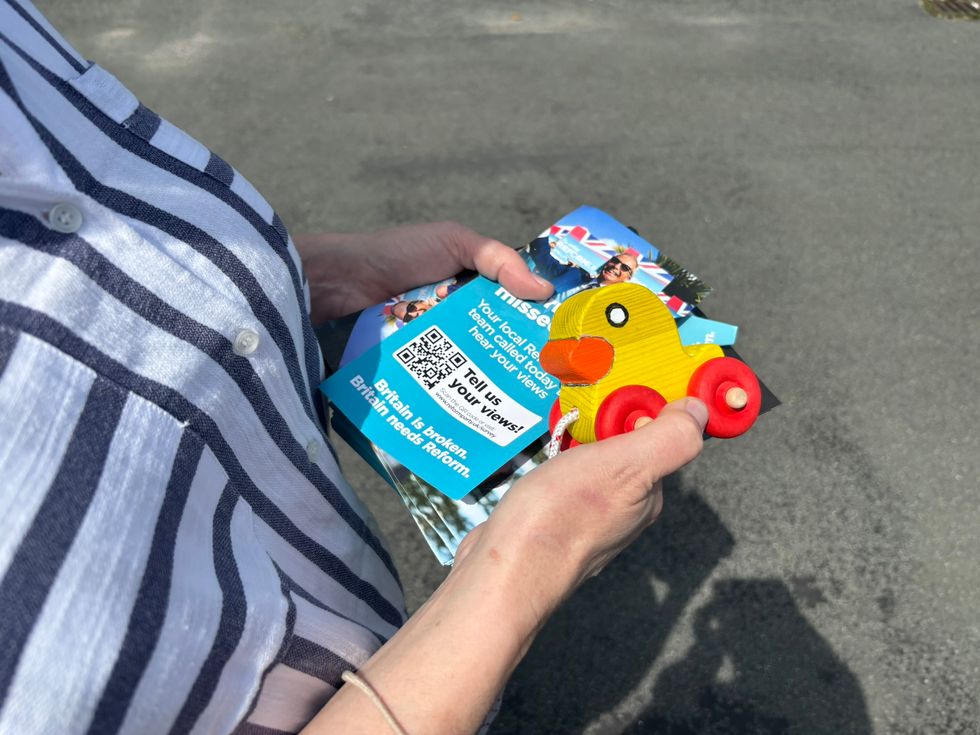 Canvasser holding homemade toy