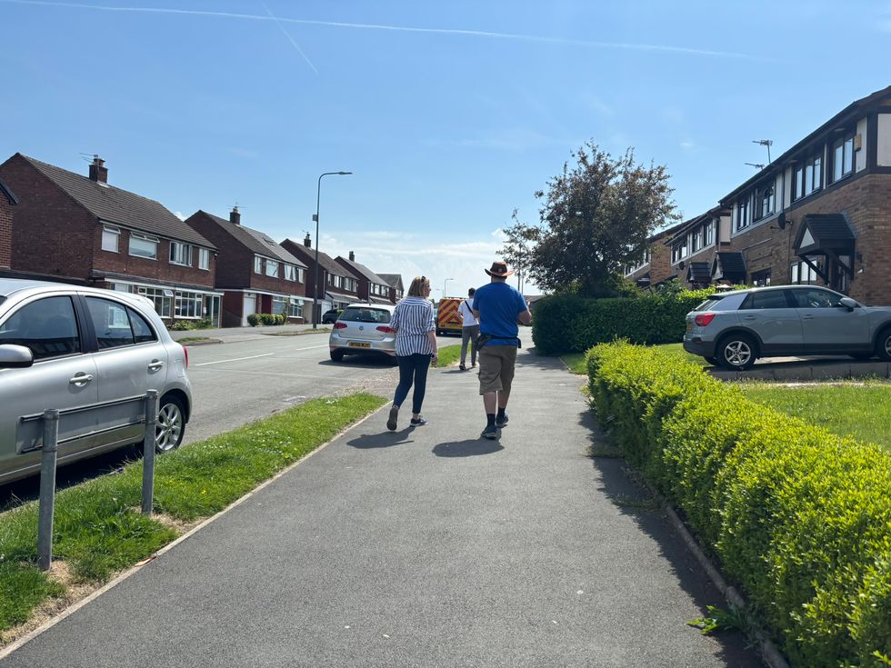 Canvassers walking along pavement