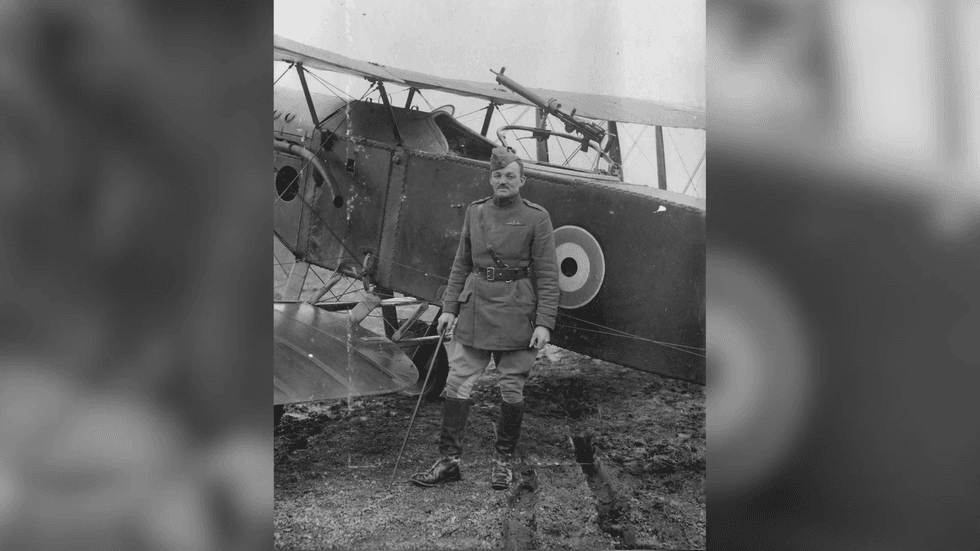 Captain Clive Franklyn Collett in front of by-plane