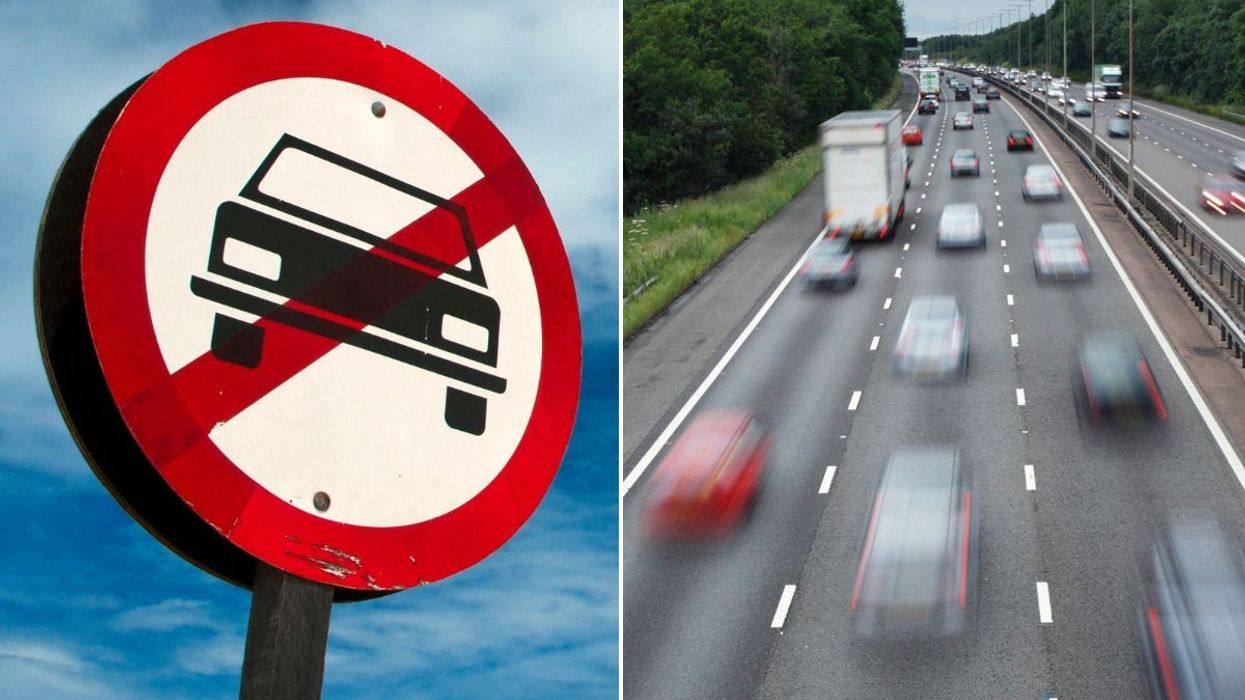 Car ban sign and a busy motorway
