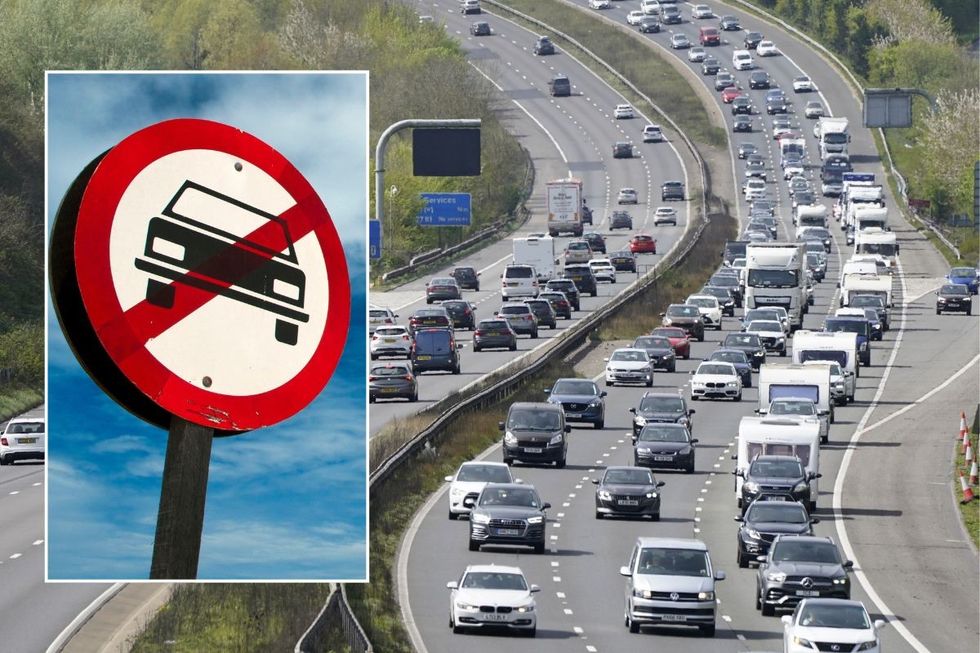 Car ban sign and a busy motorway
