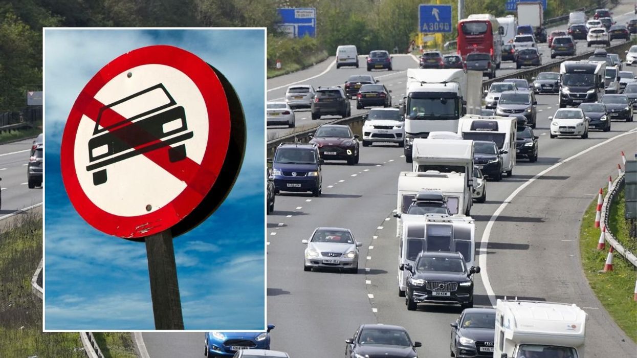 Car ban sign and a busy UK road