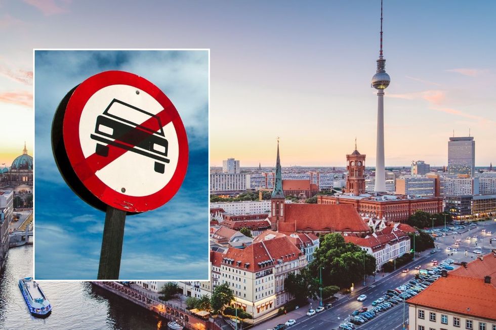 Car ban sign and a panoramic view of Berlin, Germany