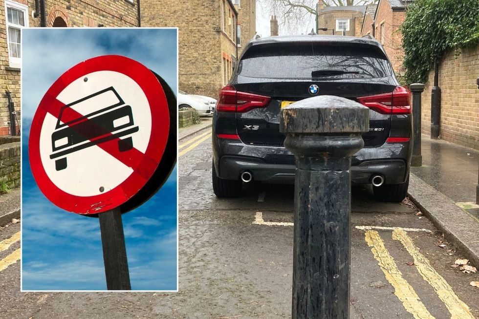 Car ban sign and a parked SUV