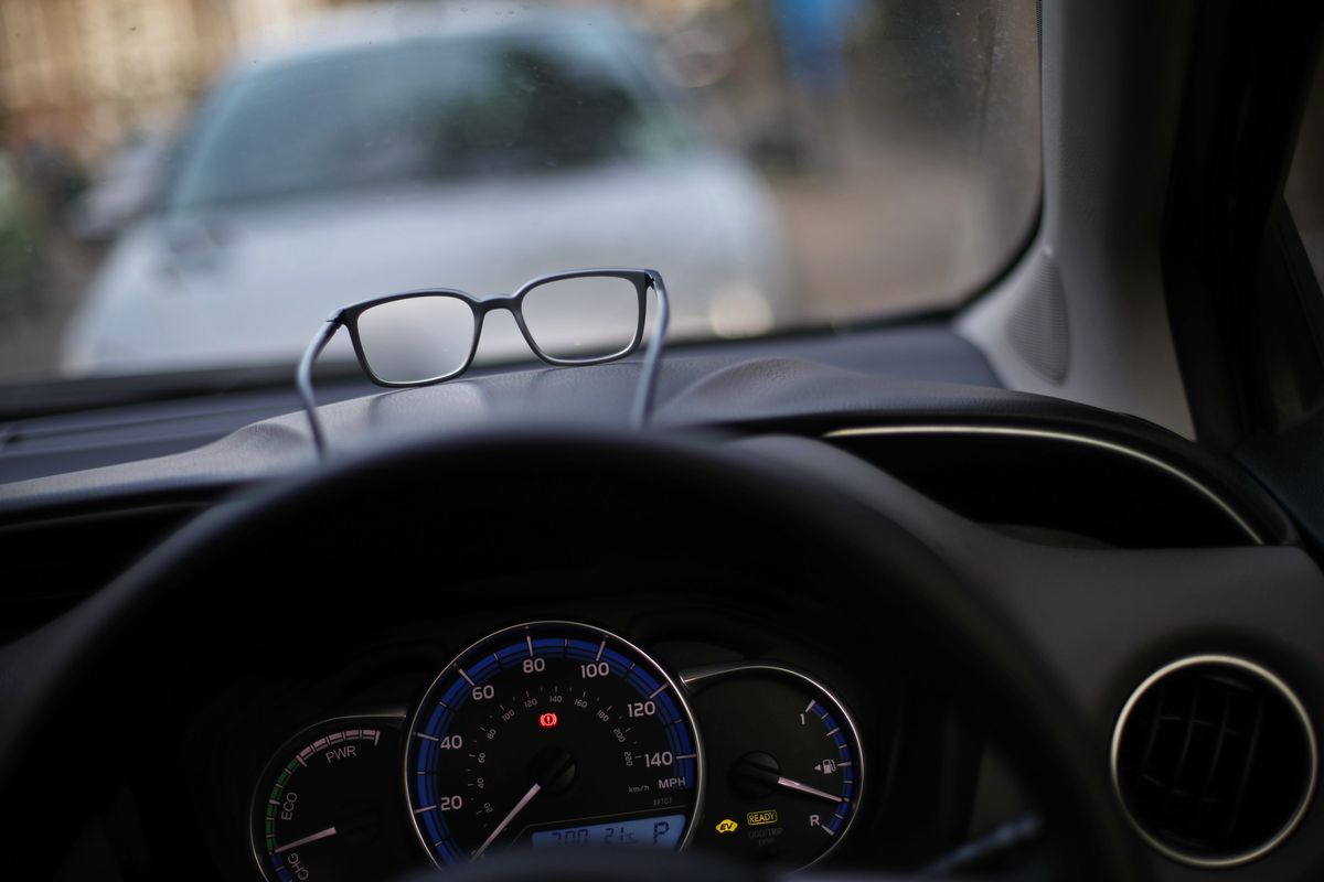Car dashboard with a pair of glasses