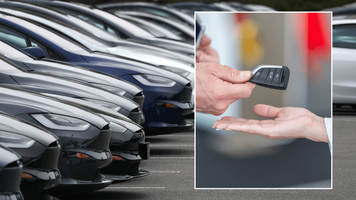 Car dealership and car keys being handed over