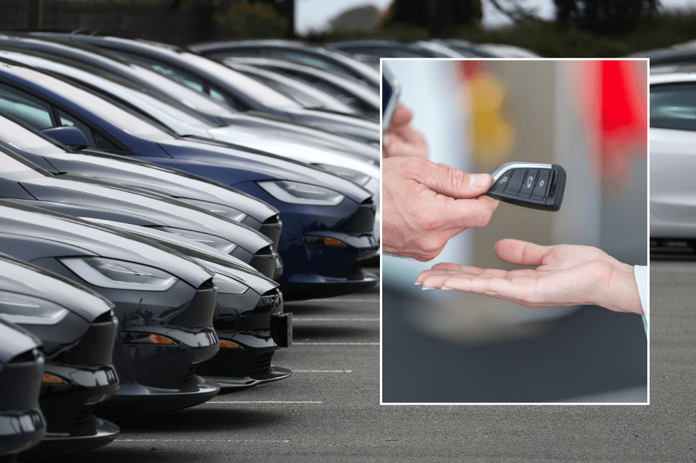 Car dealership and car keys being handed over