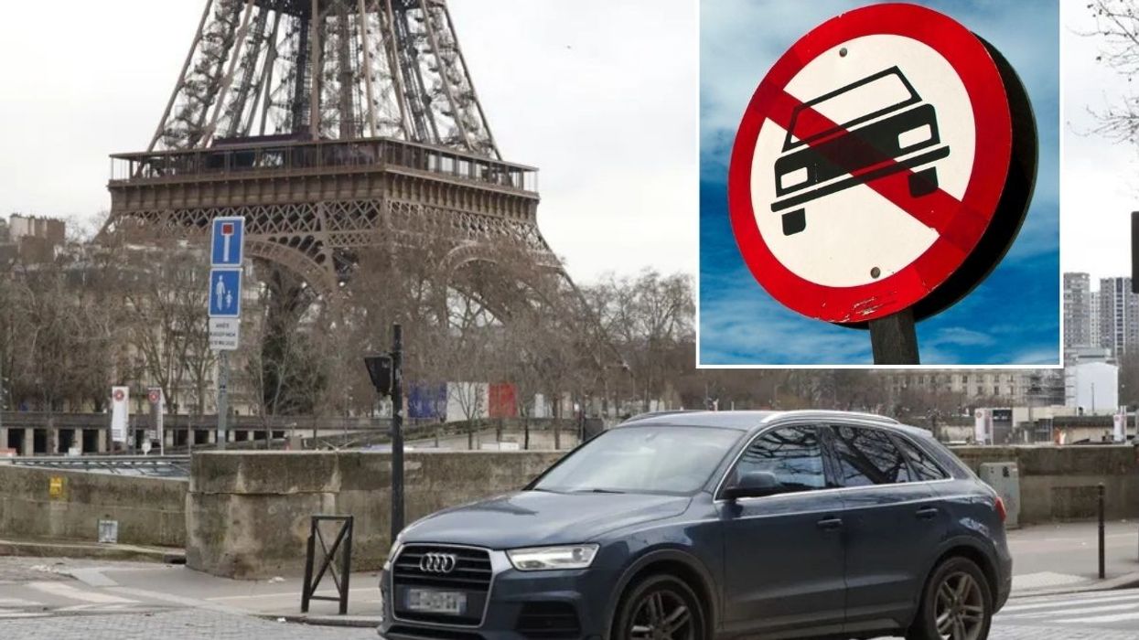 Car driving in Paris and a vehicle ban sign