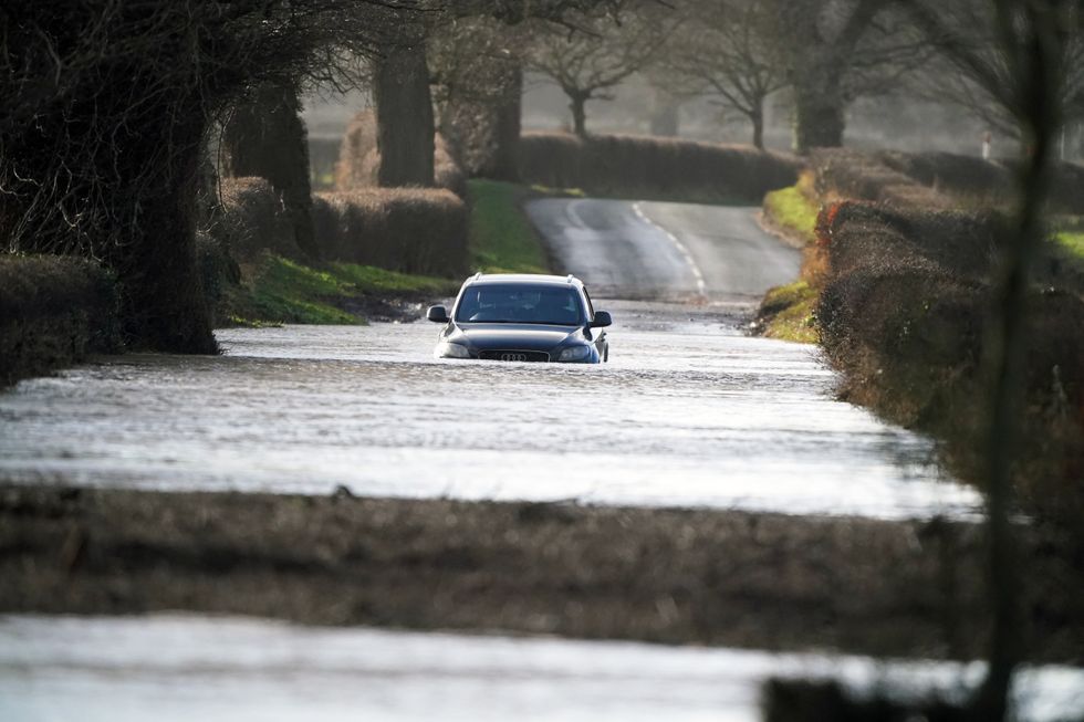 Car driving through flood water