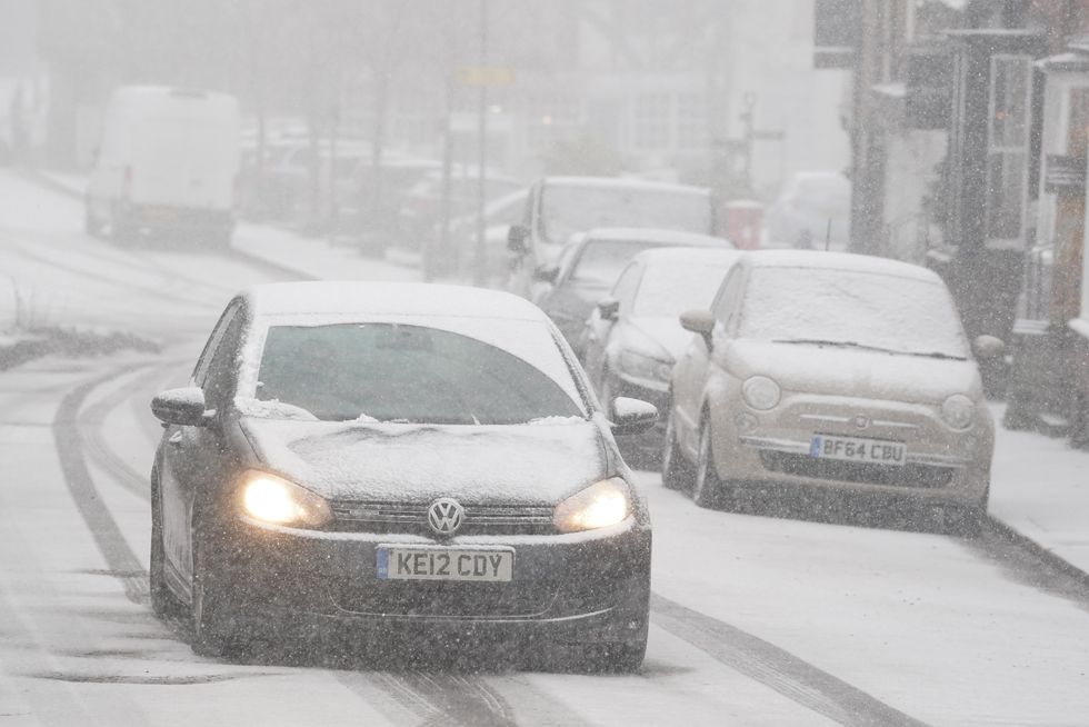 Car driving through snow