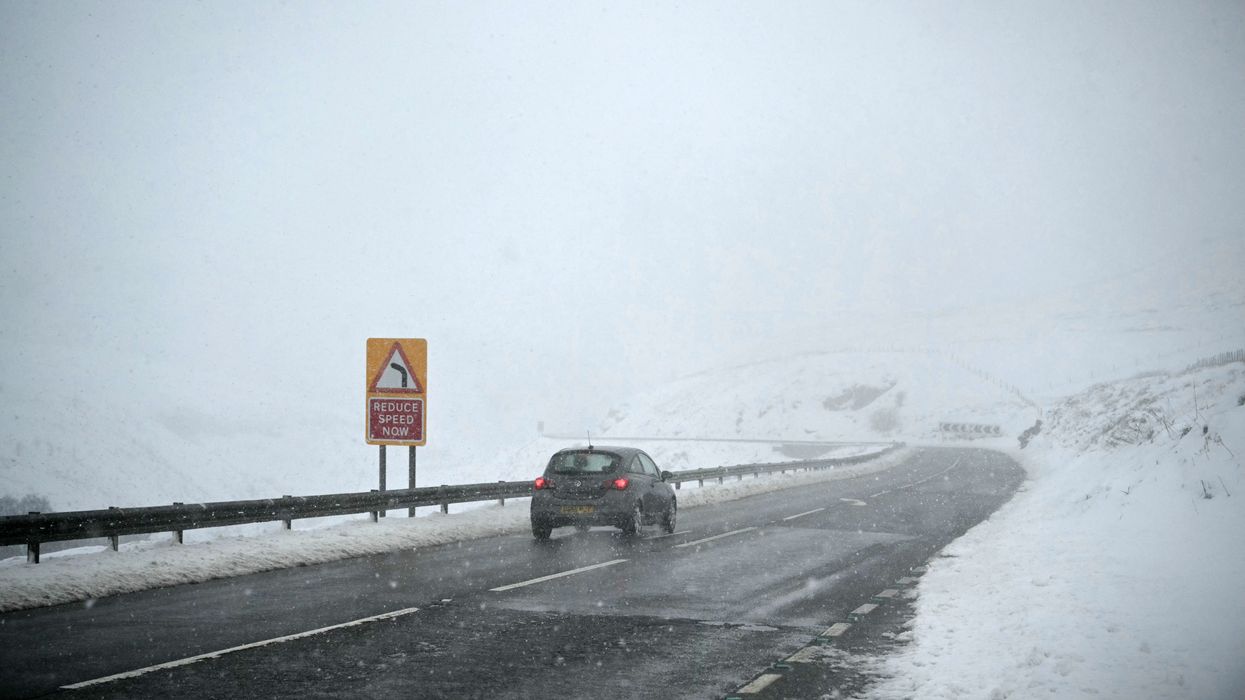 Car in a snowy Peak District