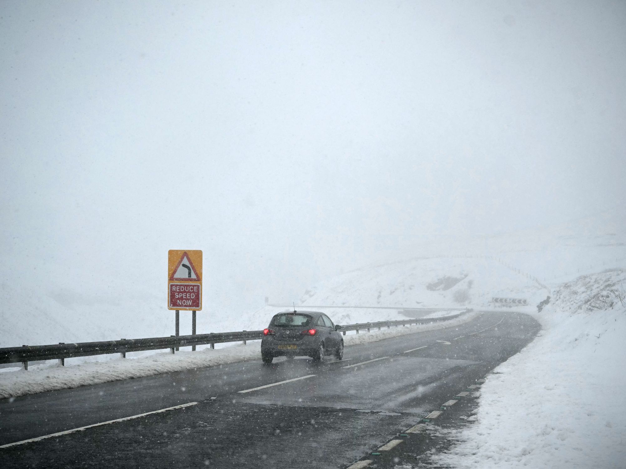 Car in a snowy Peak District