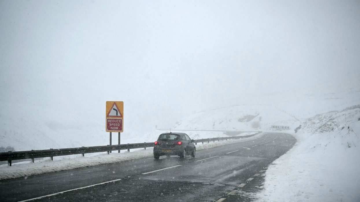 Car in a snowy Peak District