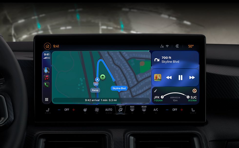 Car infotainment system running CarPlay 26