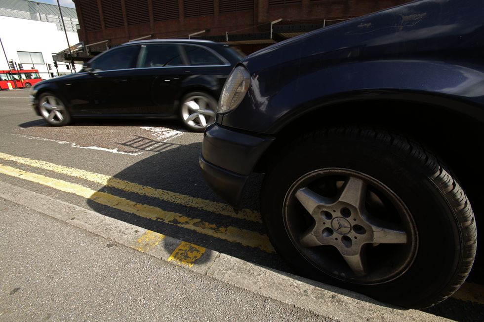 Car parked on double yellow lines