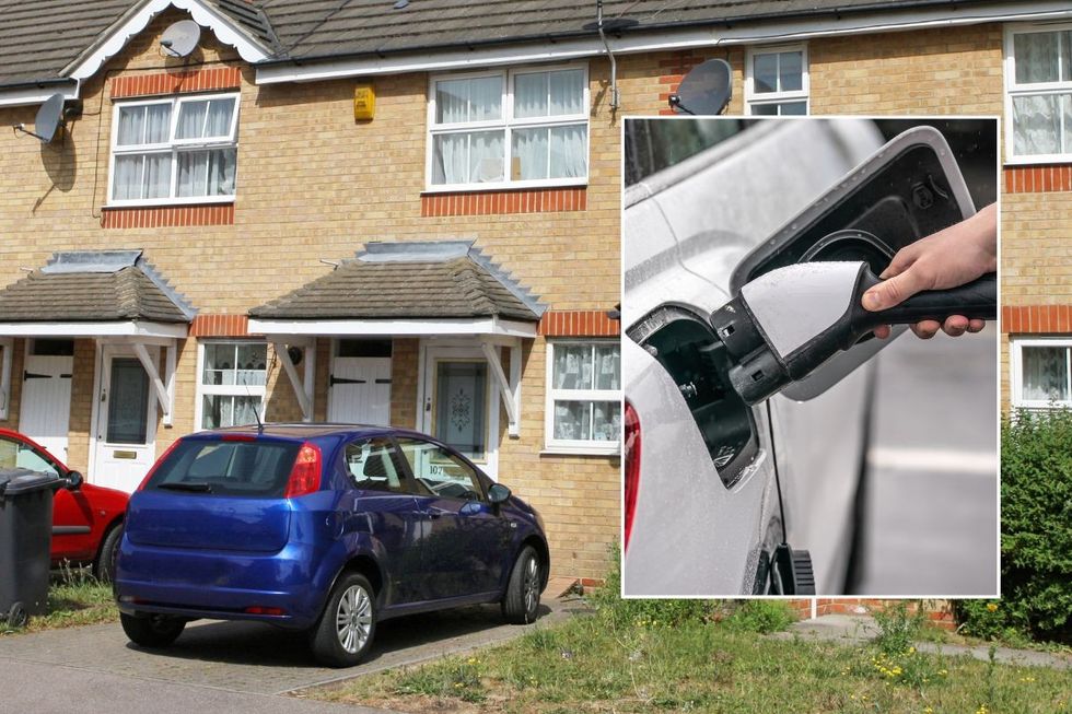Car parked on driveway and an electric car charger