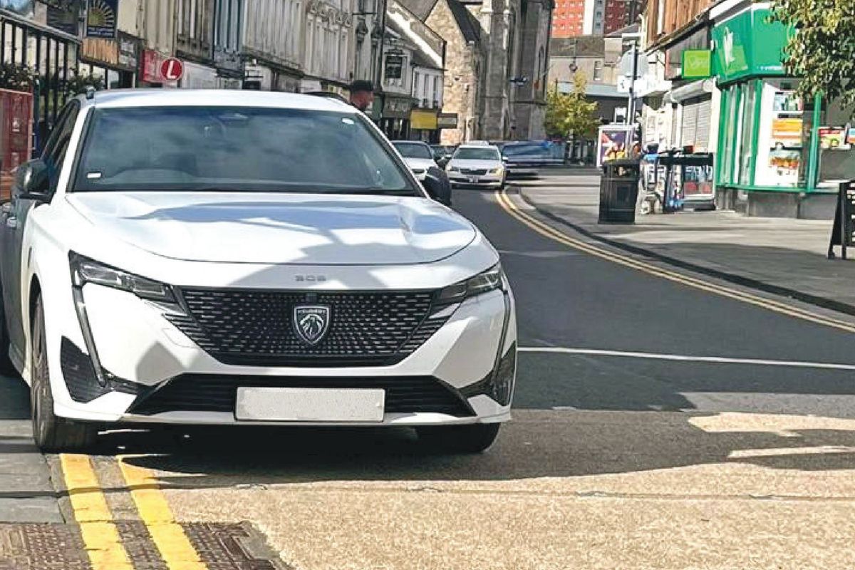 Car parked on yellow lines