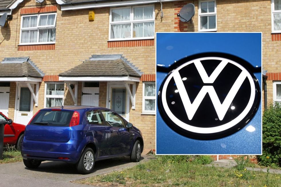 Car parked outside home and a VW logo