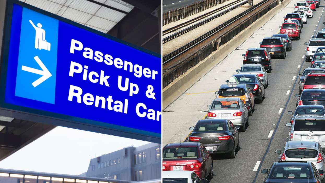 Car rental sign and a busy road