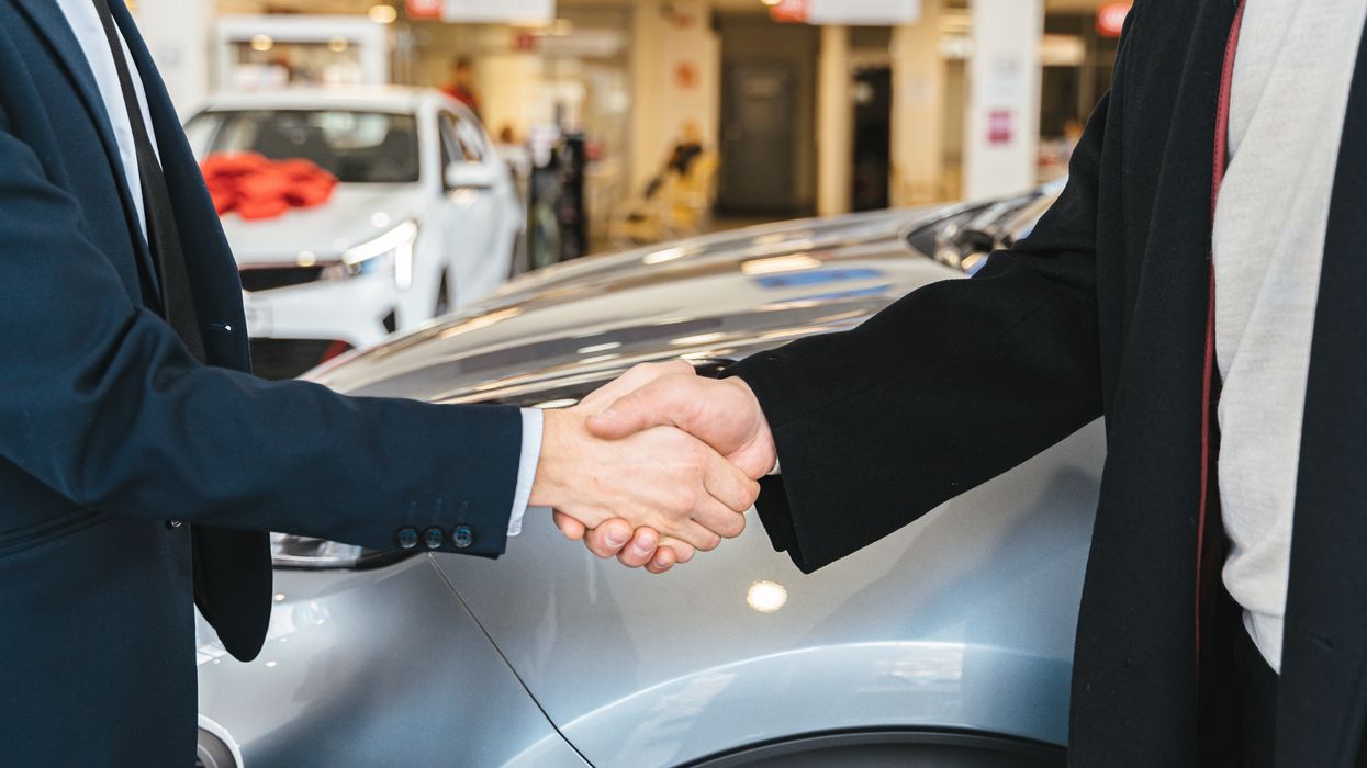Car sale, shaking hands