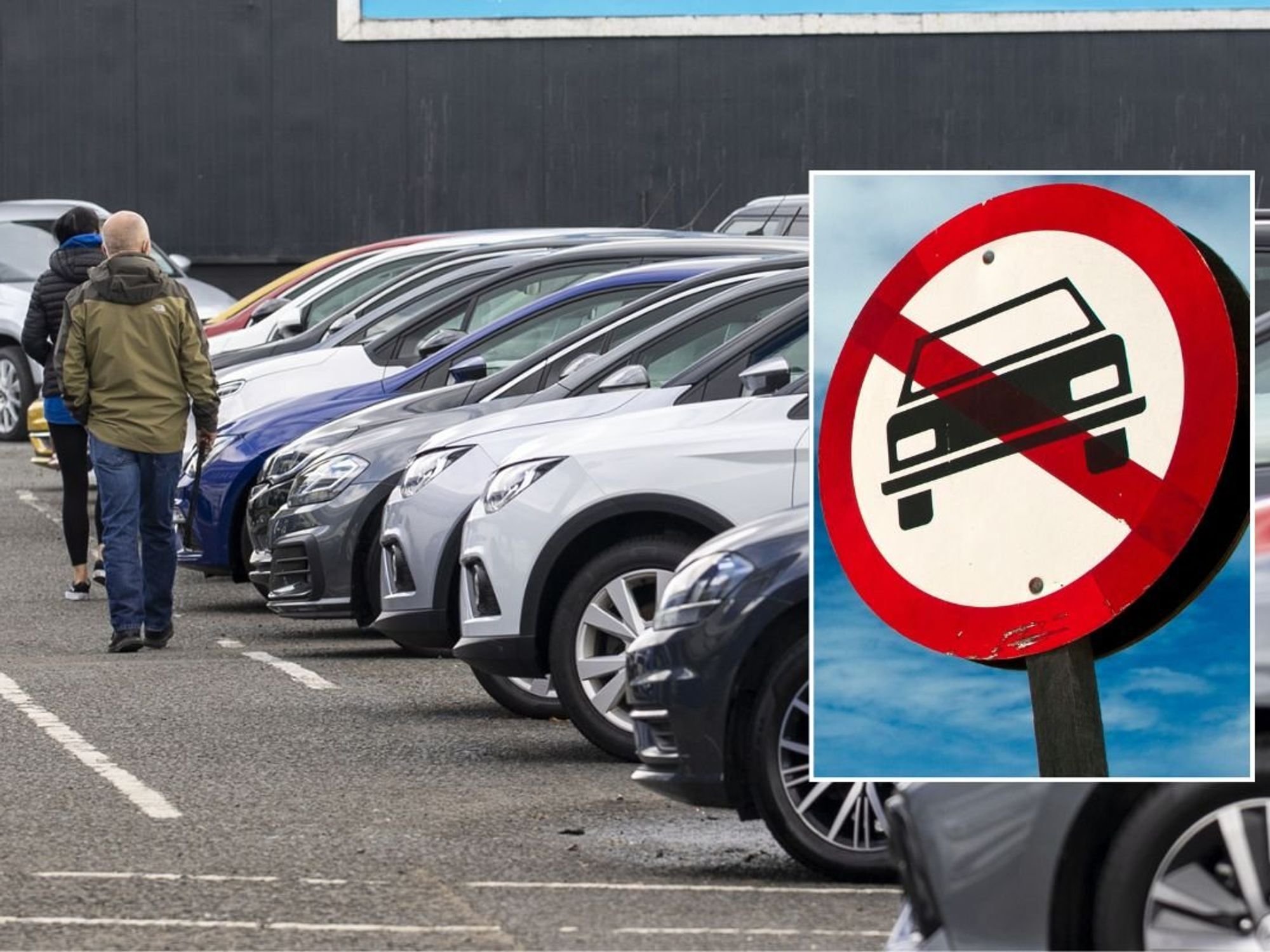 Car sales lot and a vehicle ban sign