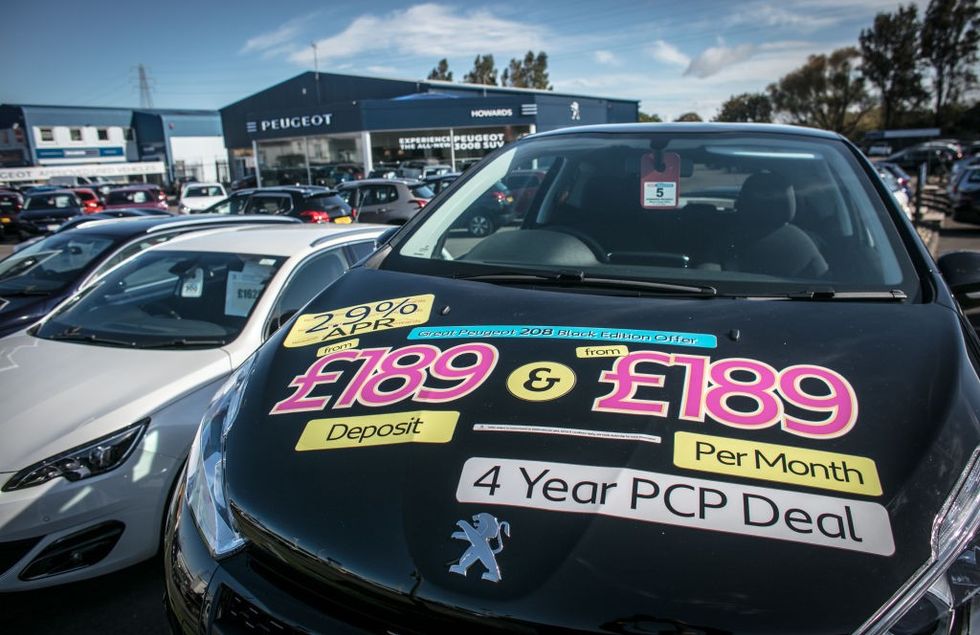 car sales sign on vehicle