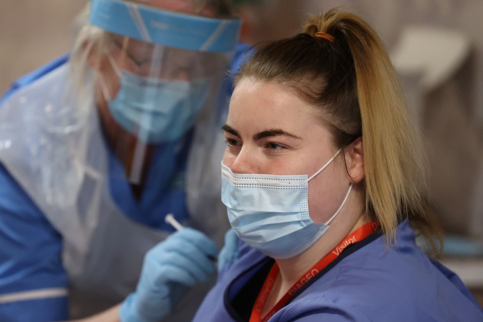 Care home staff receive the Pfizer/BioNtech covid-19 vaccine at Bradley Manor residential care home in Belfast.