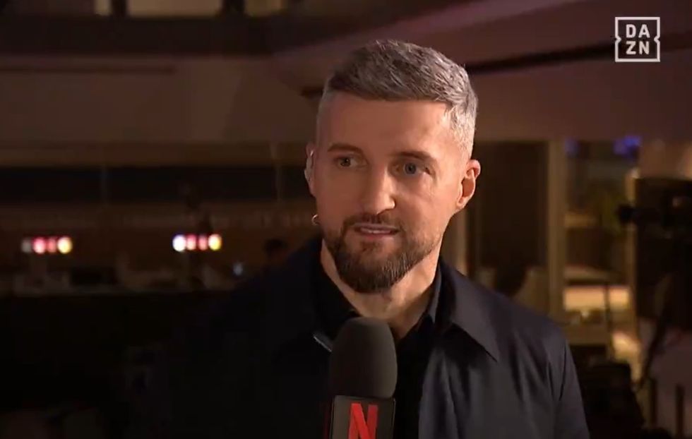 Carl Froch was presenting for DAZN while John Fury can be heard in the background