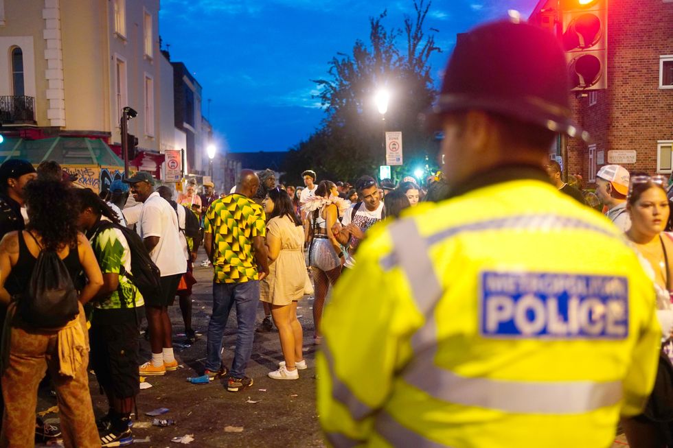 Carnival-goers are seen enjoying the event in London.