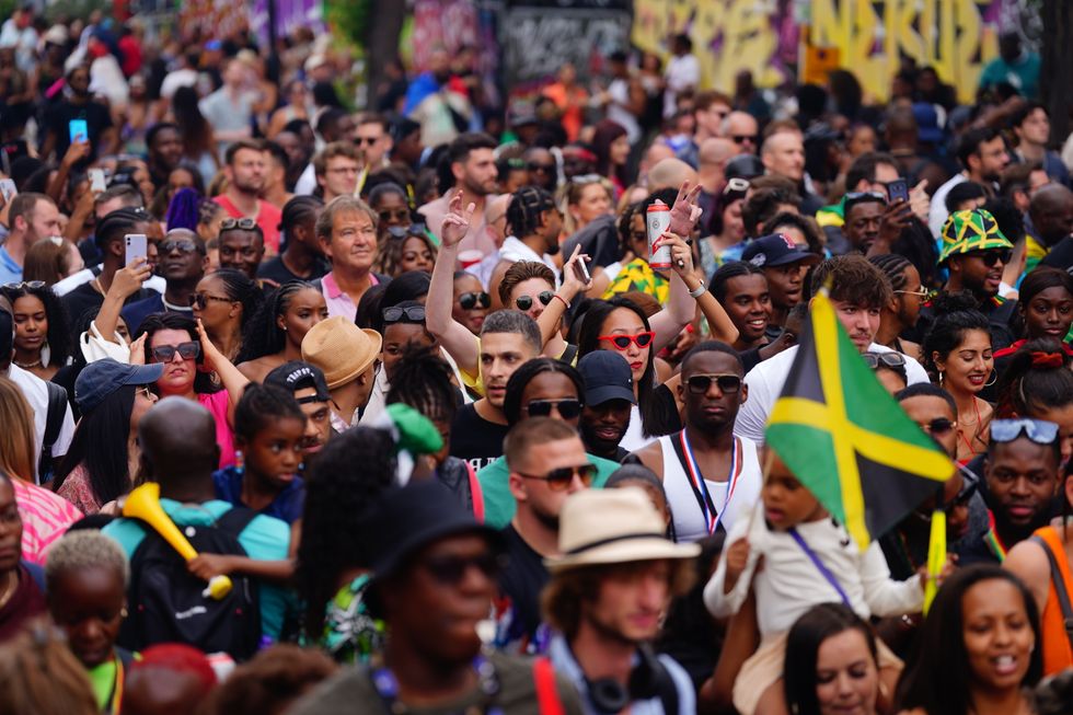 Carnival-goers during the Family Day at the Notting Hill Carnival in London, which returned to the streets for the first time on two years, after it was thwarted by the pandemic.