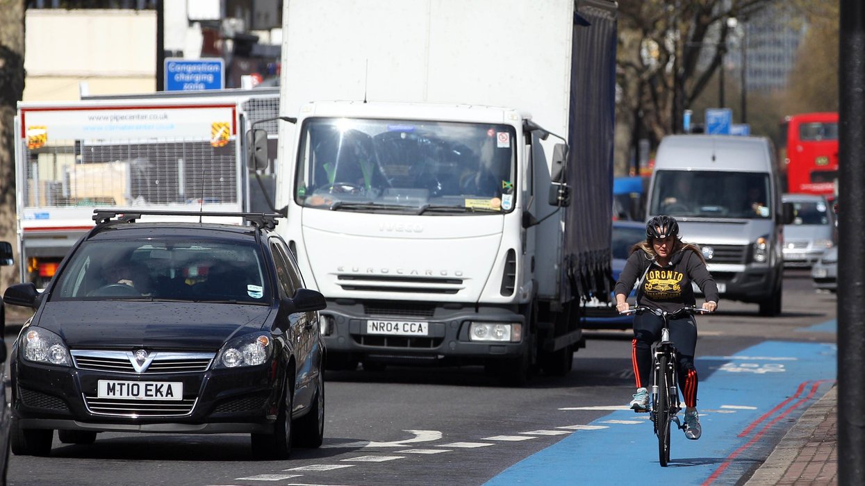Cars and a bike on the road